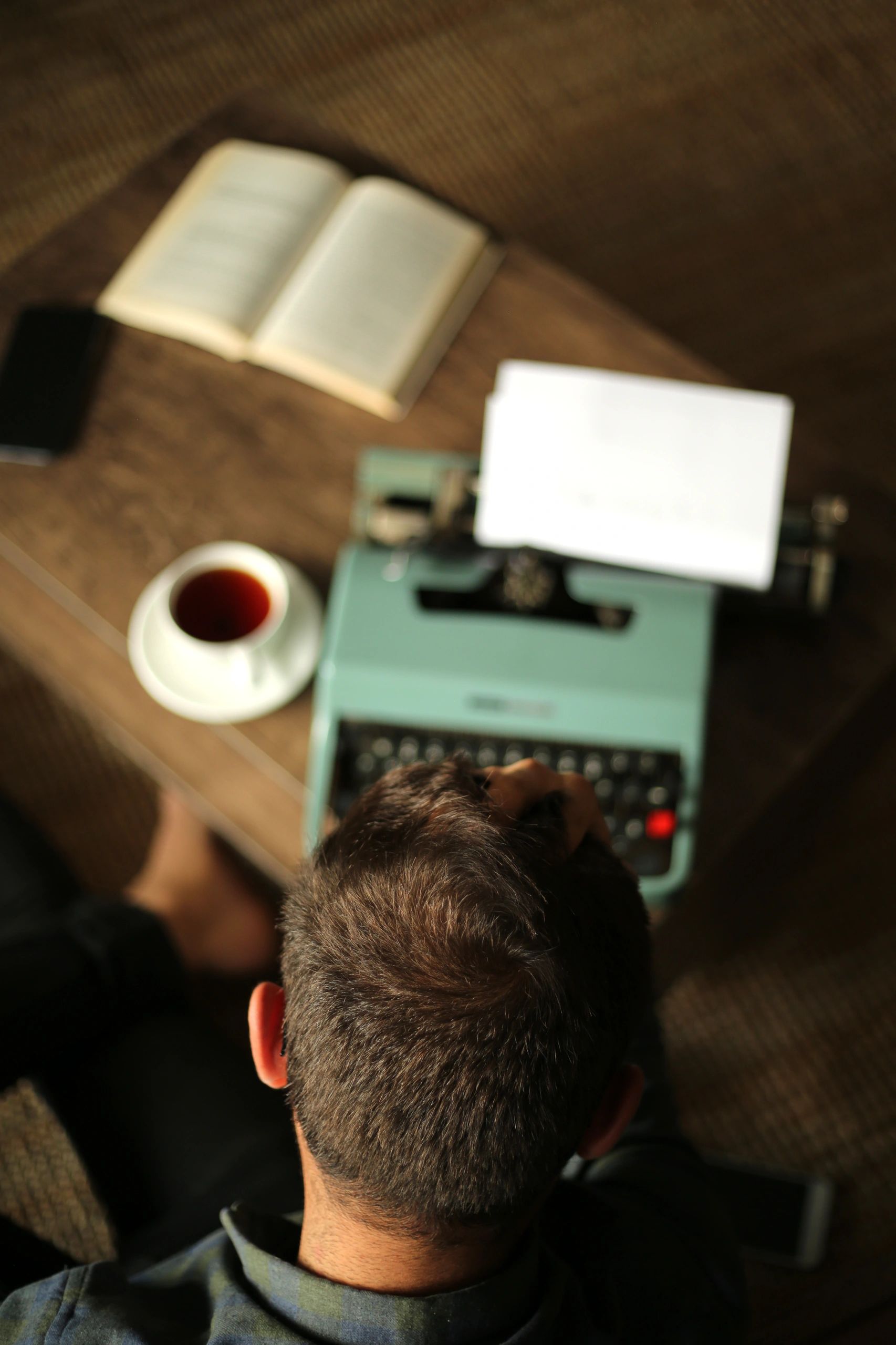 Thoughtful writer working at a typewriter