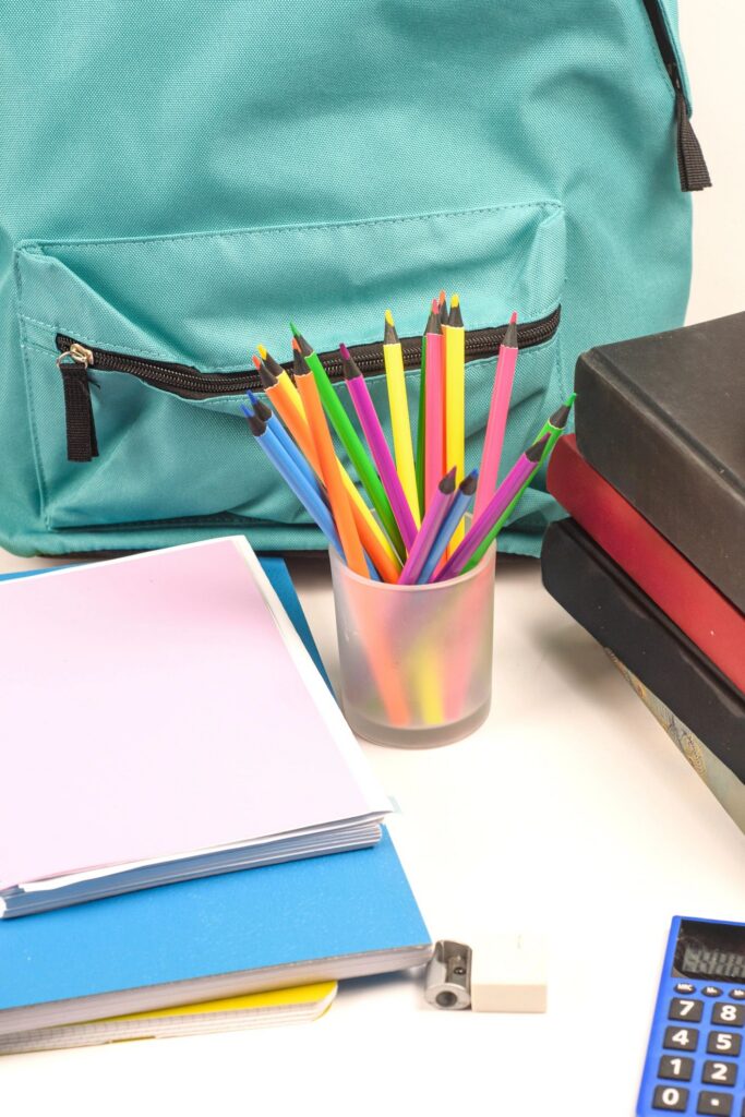 Close up of colored pencils and backpack for back to school