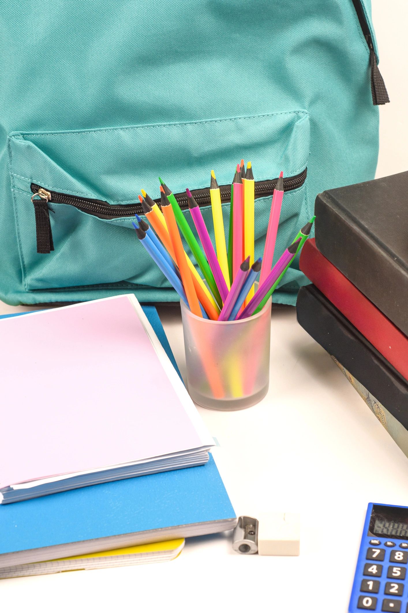 Close up of colored pencils and backpack for back to school