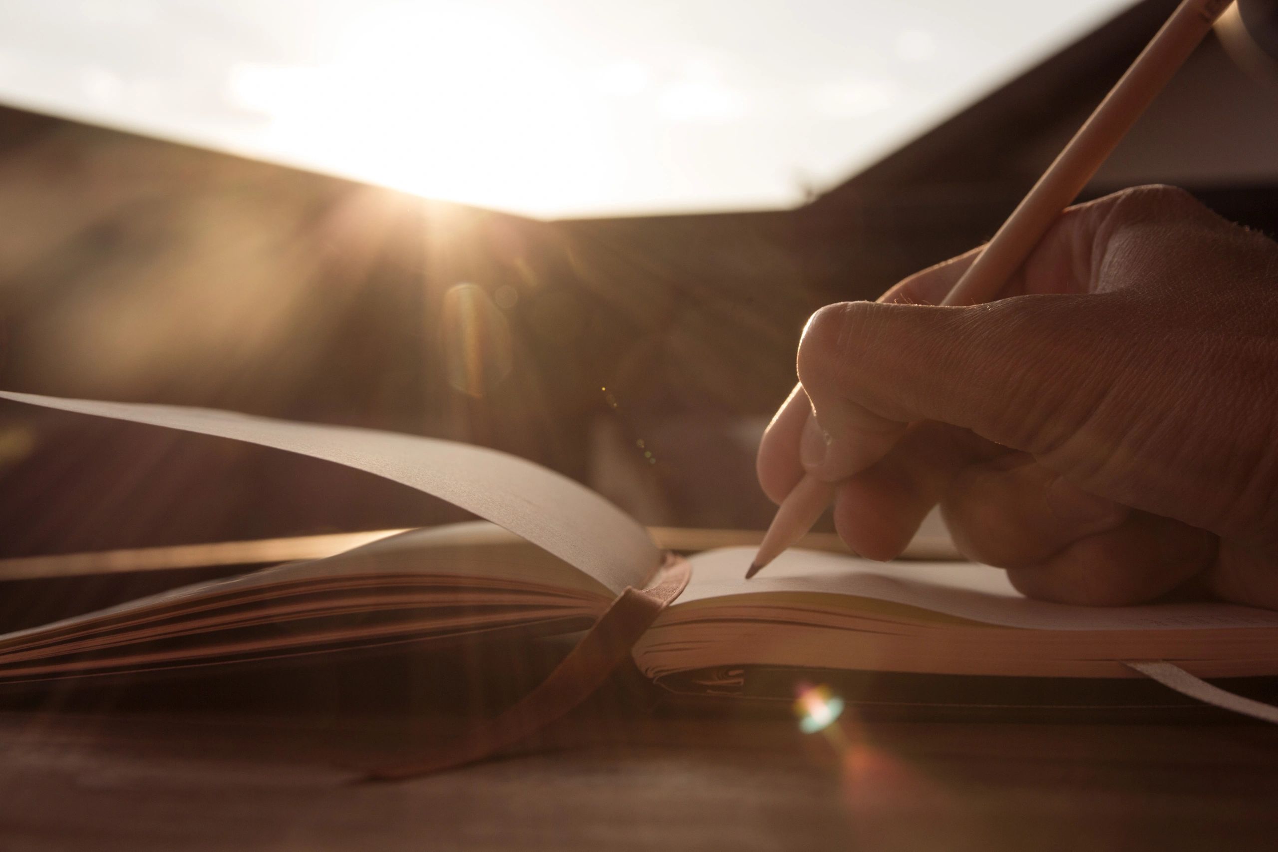 Writer taking notes by hand